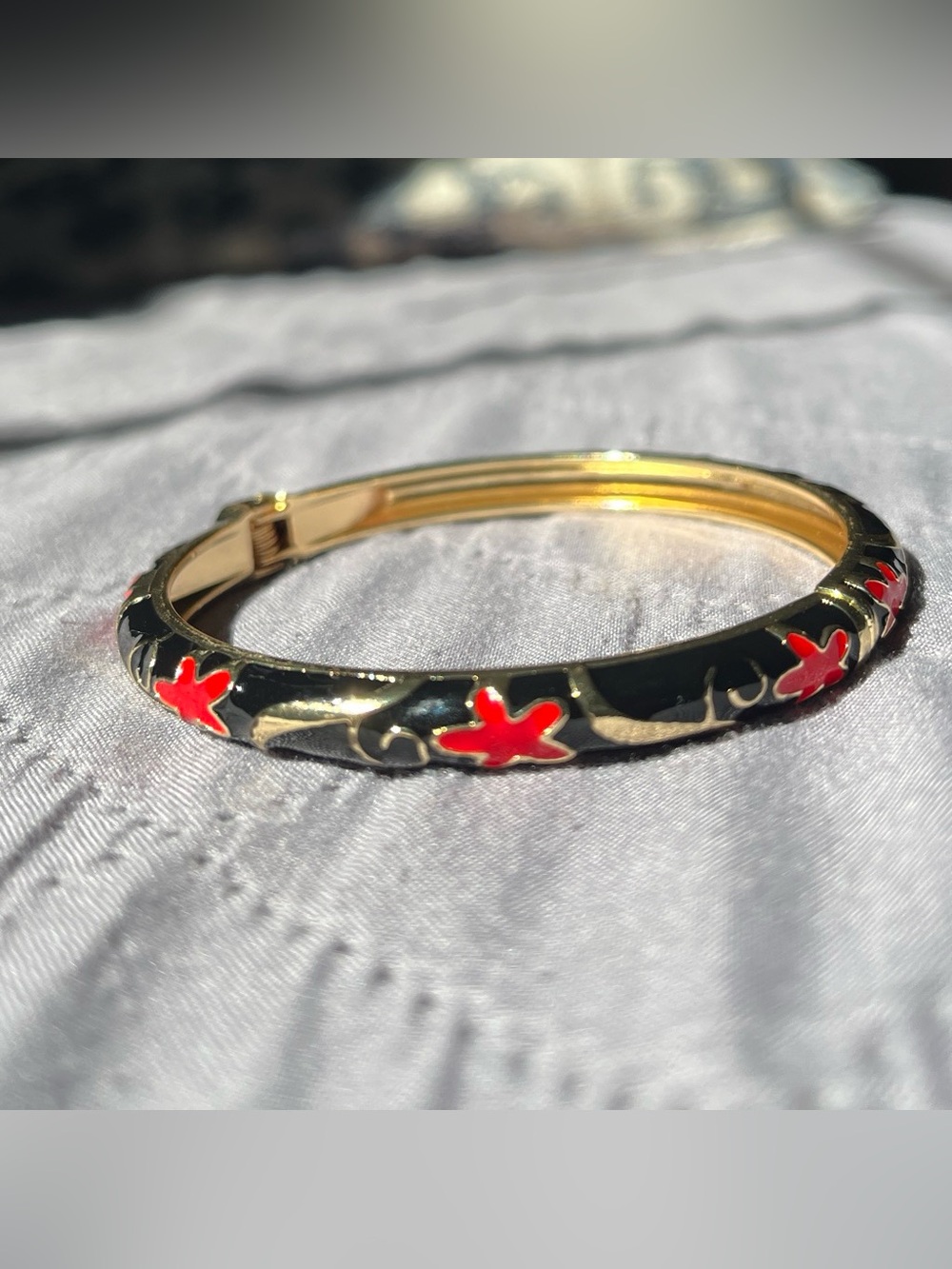 Gold-Tone Black Enamel Bangle with Red Floral Accents